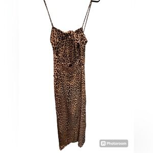 Leopard print dress ties in back, buttons on side. Perfect for a wedding or date
